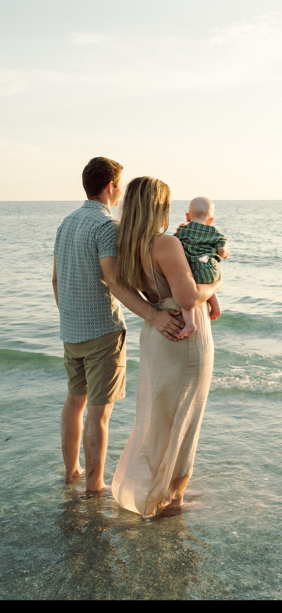 Daniel Koske with his family standing in the Gulf in Pinellas County